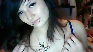 Pretty cute dark-haired emo is masturbating on the cam