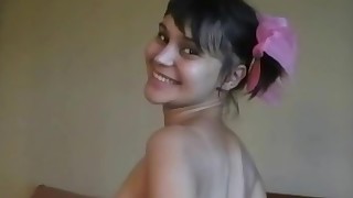 Adorable skinny teen joyfully masturbates